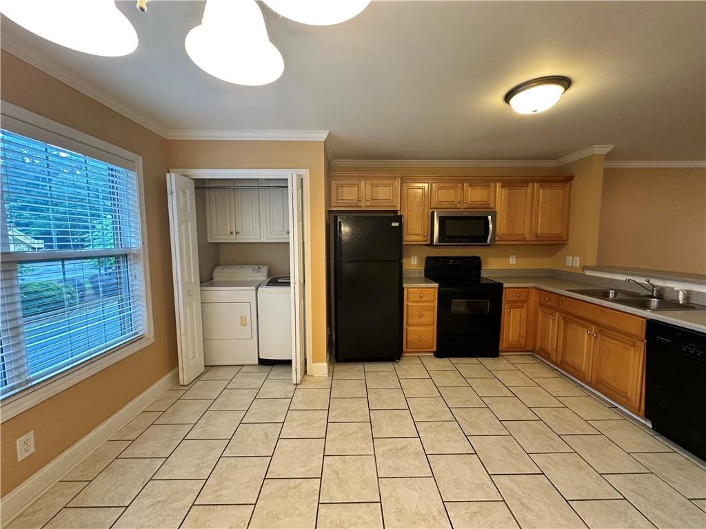 105 Whitehead Road, Unit 10 Athens, GA 30606 - Photo 7 of 16 a kitchen with stainless steel appliances granite countertop a refrigerator and a stove top oven