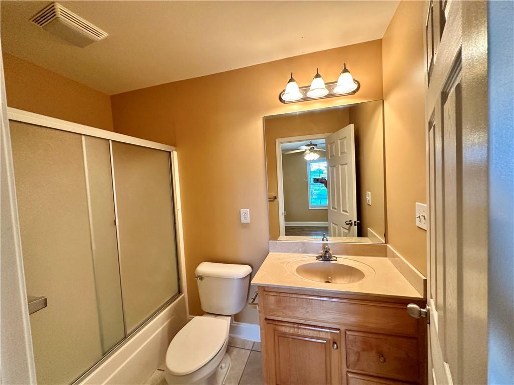 105 Whitehead Road, Unit 10 Athens, GA 30606 - Photo 9 of 16 a bathroom with a sink a toilet and mirror