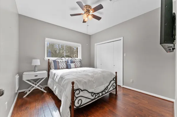 a bedroom with a bed and a chandelier