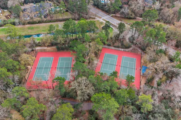 a view of a backyard with chairs