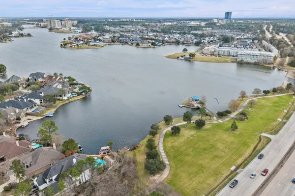 an aerial view of a house with a lake view