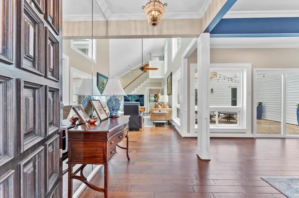 a view of a livingroom with furniture and hardwood floor