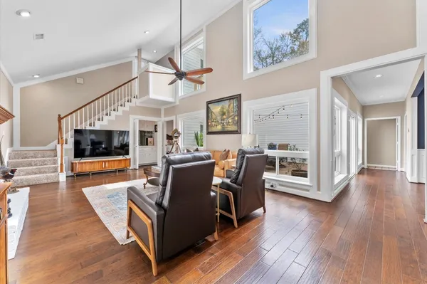 a living room with furniture and flat screen tv