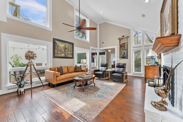 a living room with furniture or couch and a dining table