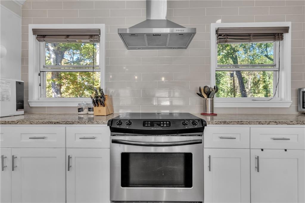 2363 Oakridge Court Decatur, GA 30032 - Photo 12 of 32 a stove top oven sitting inside of a kitchen