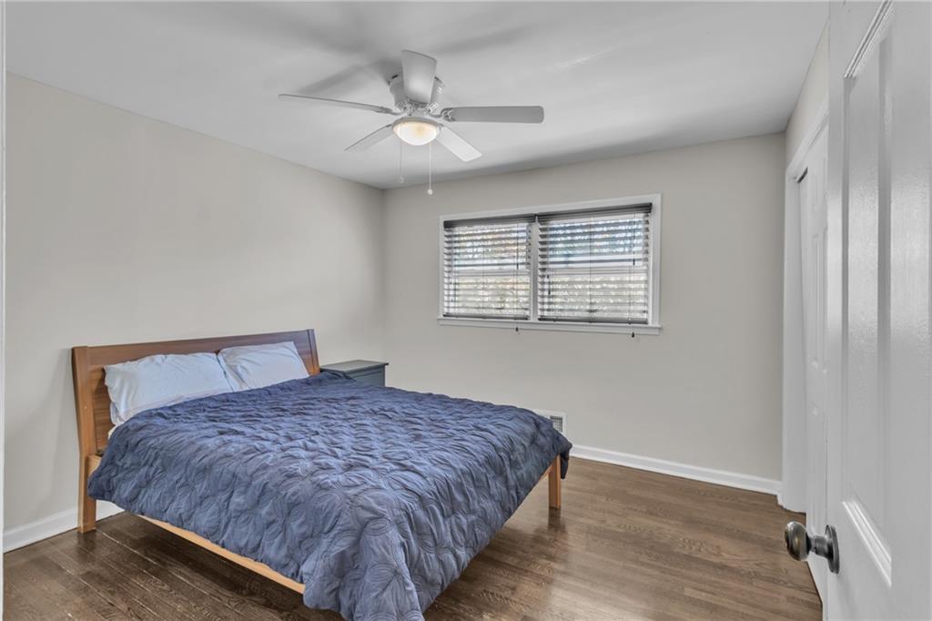 2363 Oakridge Court Decatur, GA 30032 - Photo 15 of 32 a bedroom with a bed and wooden floor