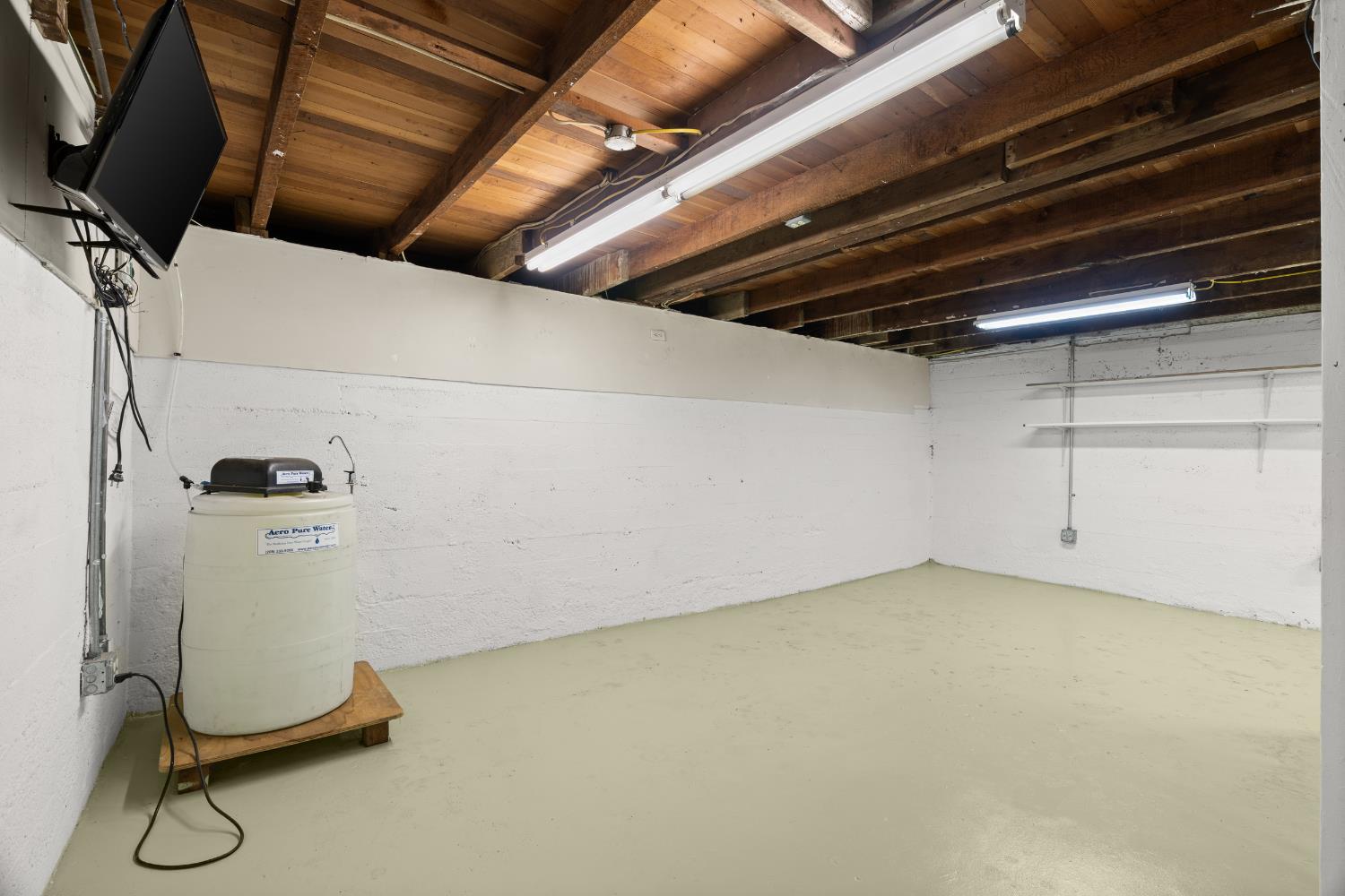 5610 North Confer Road Stockton, CA 95215 - Photo 32 of 40 Finished basement, large space. Water filter present.