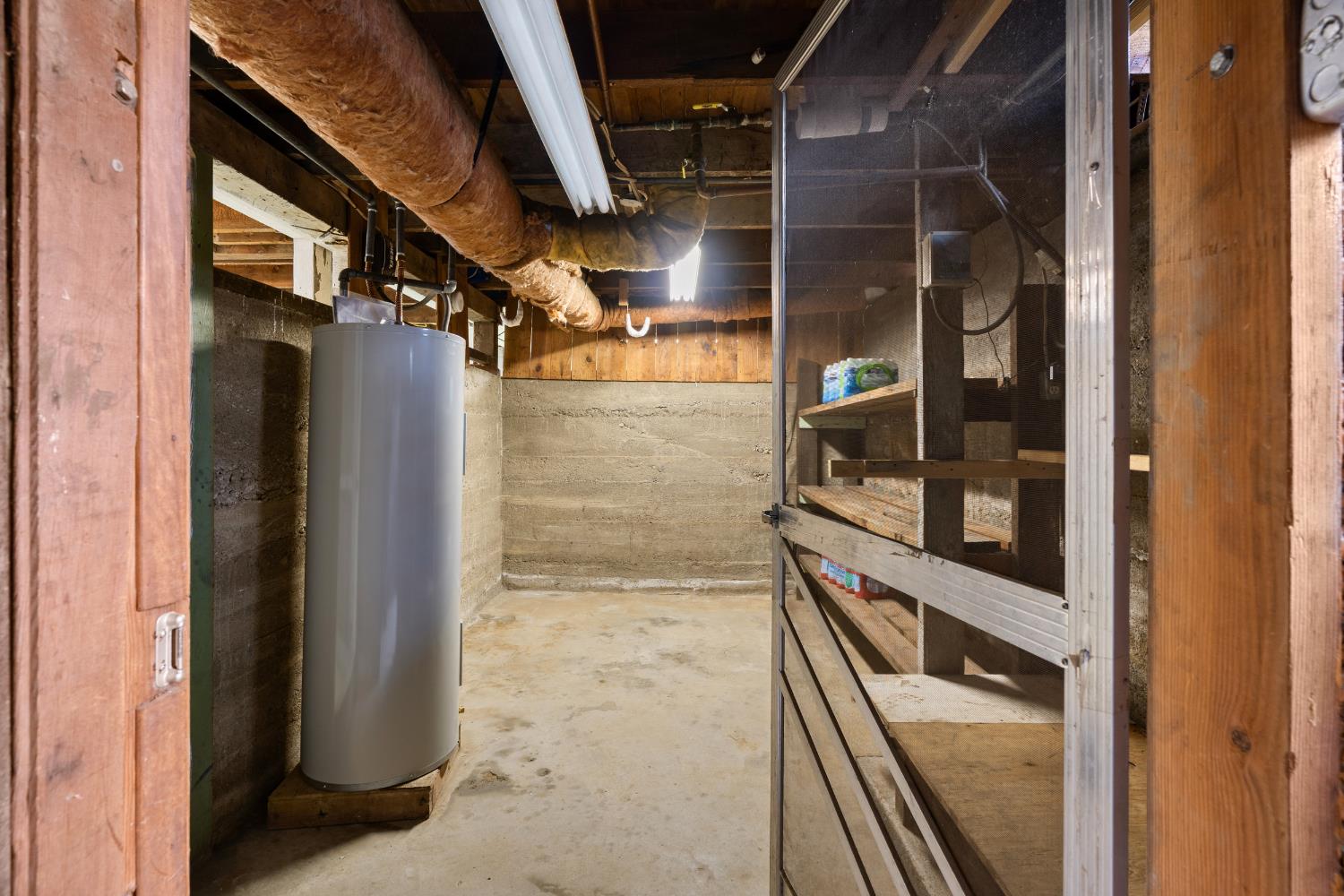 5610 North Confer Road Stockton, CA 95215 - Photo 34 of 40 Basement, second room, water heater.