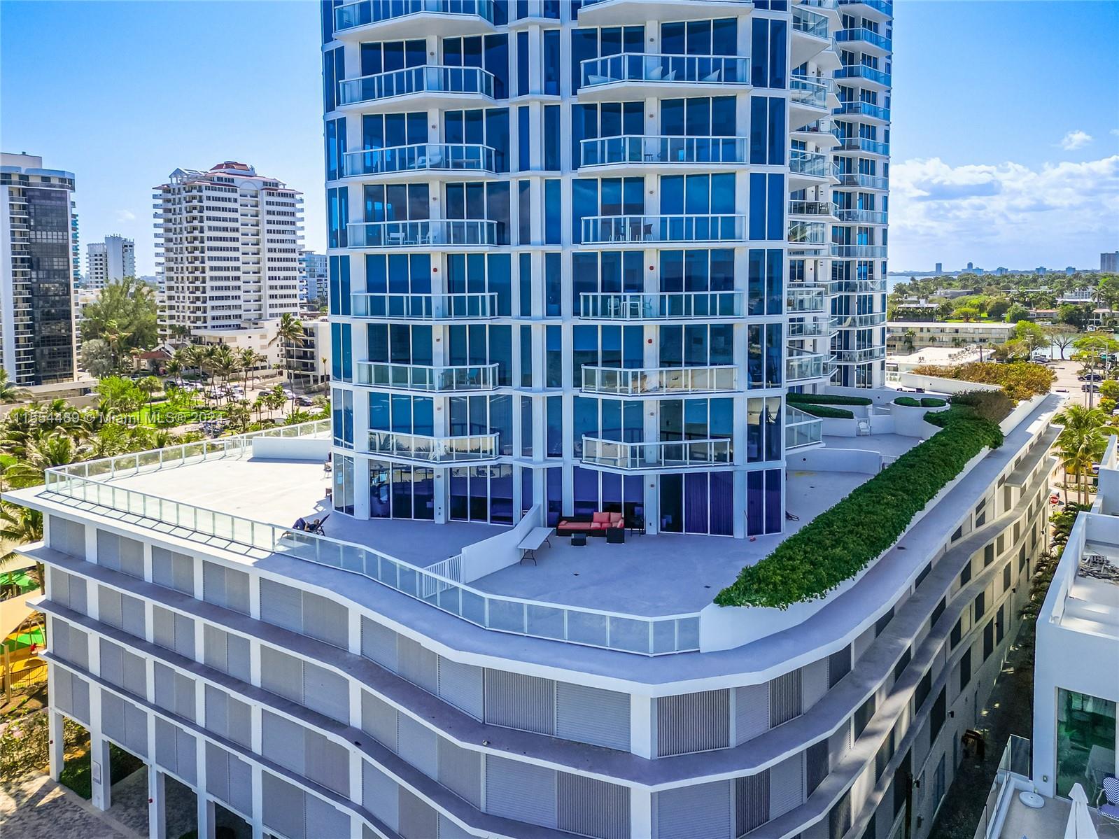 a view of a balcony with floor & a building