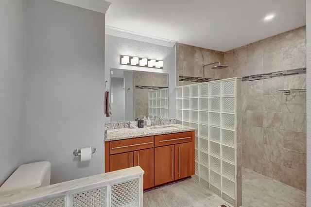 a kitchen with granite countertop stainless steel appliances and wooden cabinets