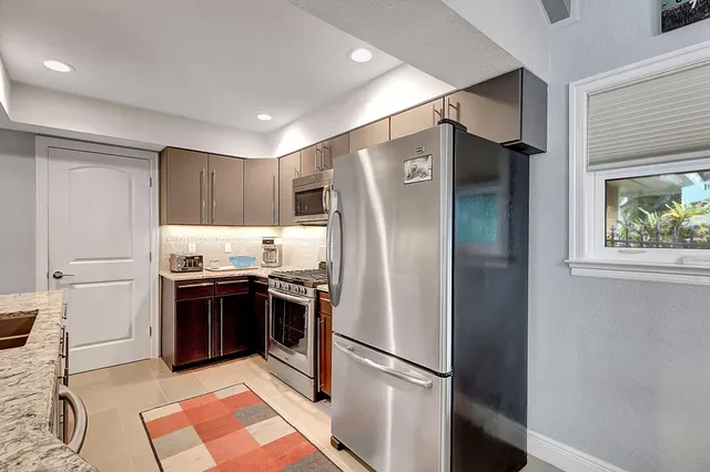 a view of a storage & utility room with racks on the wall