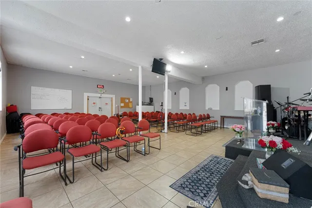 a living room with lots of furniture and white walls
