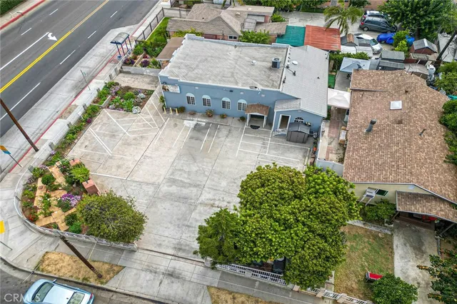 an aerial view of a house with a yard