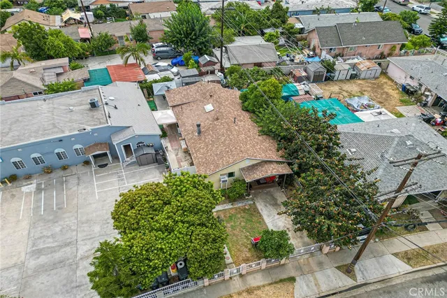 an aerial view of a house with outdoor space