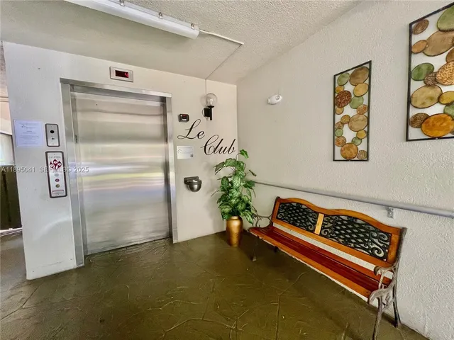 a kitchen with stainless steel appliances a stove a microwave sink and cabinets