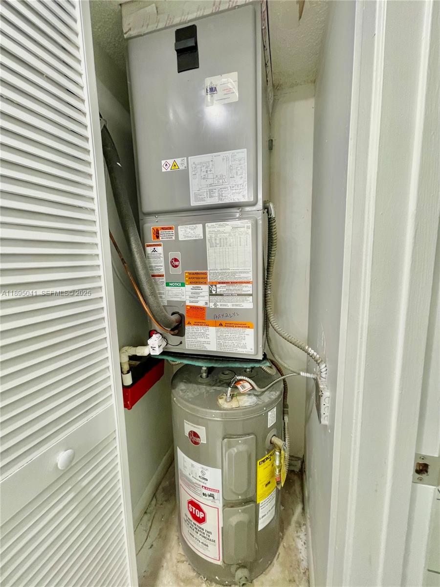 2209 South Cypress Bend Drive, Unit 407 Pompano Beach, FL 33069 - Photo 30 of 53 a utility room with dryer and washer