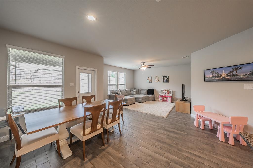 1212 Bosque Lane Weatherford, TX 76087 - Photo 11 of 38 a living room with furniture and a wooden floor