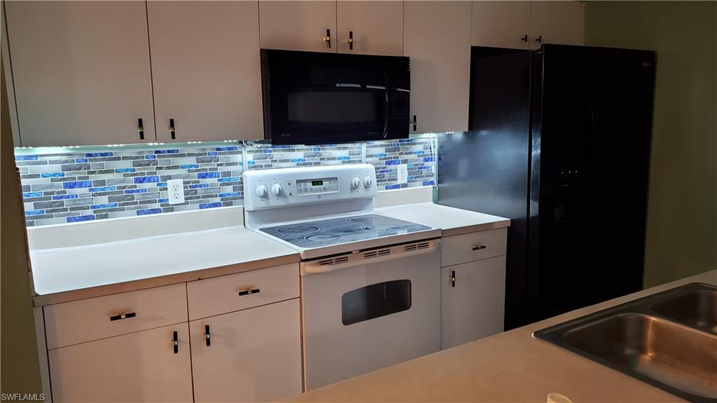 7319 Albany Road Fort Myers, FL 33967 - Photo 13 of 47 a view of a kitchen counter space and cabinets