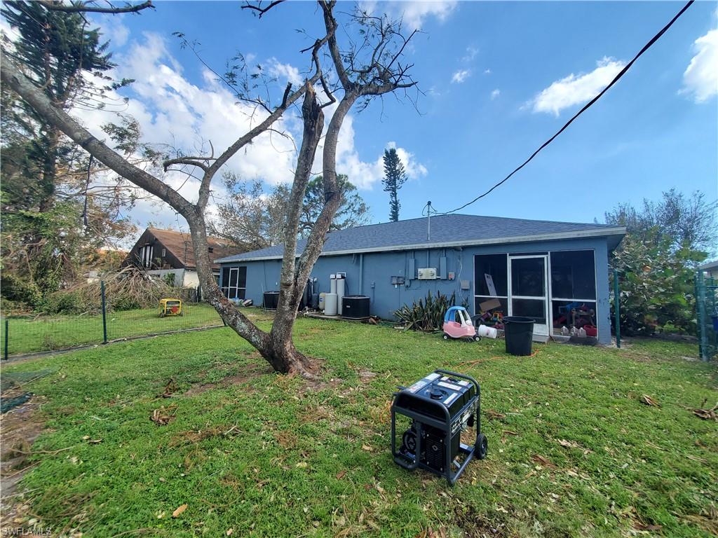 7319 Albany Road Fort Myers, FL 33967 - Photo 16 of 47 a front view of a house with garden