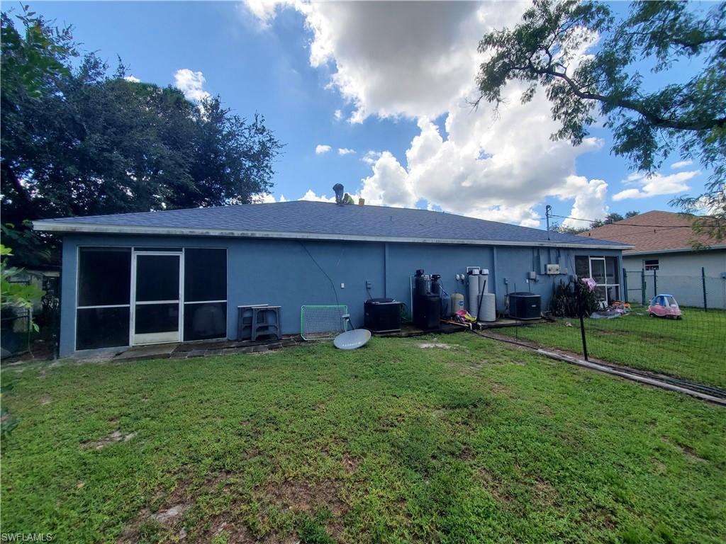 7319 Albany Road Fort Myers, FL 33967 - Photo 17 of 47 a view of a house with a yard and sitting area