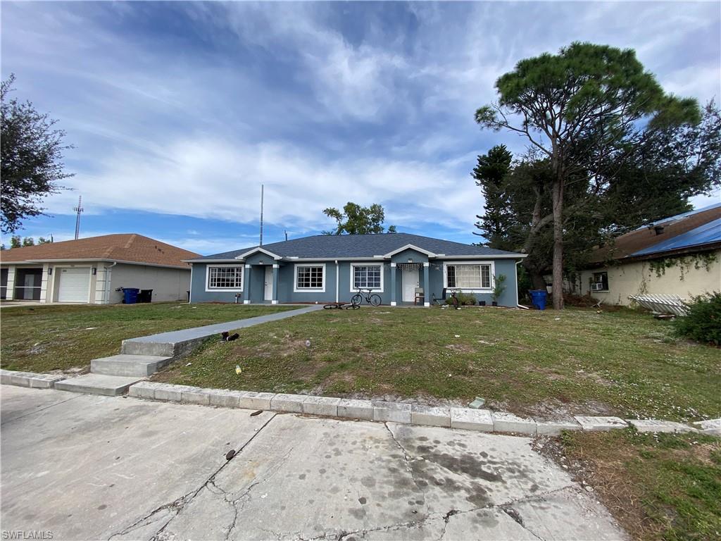 7319 Albany Road Fort Myers, FL 33967 - Photo 18 of 47 a front view of a house with a garden