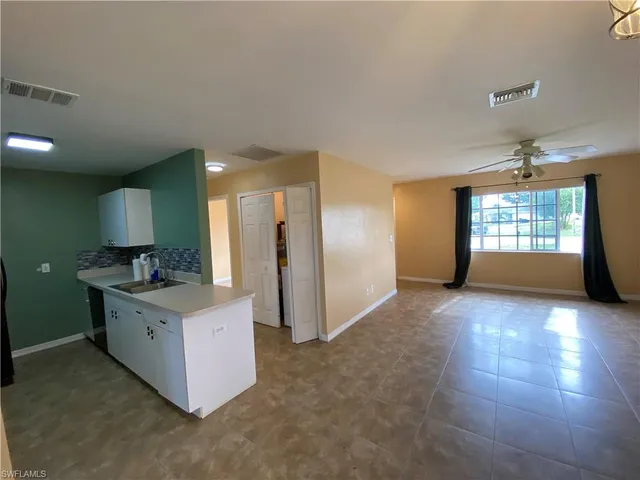 a view of empty room with fan