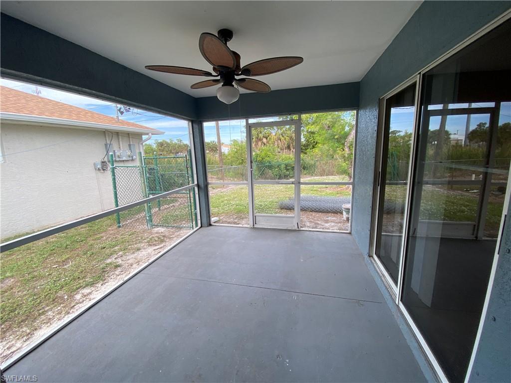 7319 Albany Road Fort Myers, FL 33967 - Photo 3 of 47 a view of an empty room and window with a ceiling fan
