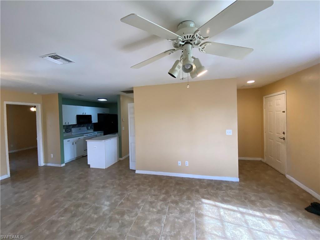 7319 Albany Road Fort Myers, FL 33967 - Photo 40 of 47 a view of an empty room and kitchen view