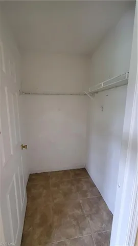 a view of a kitchen and a refrigerator