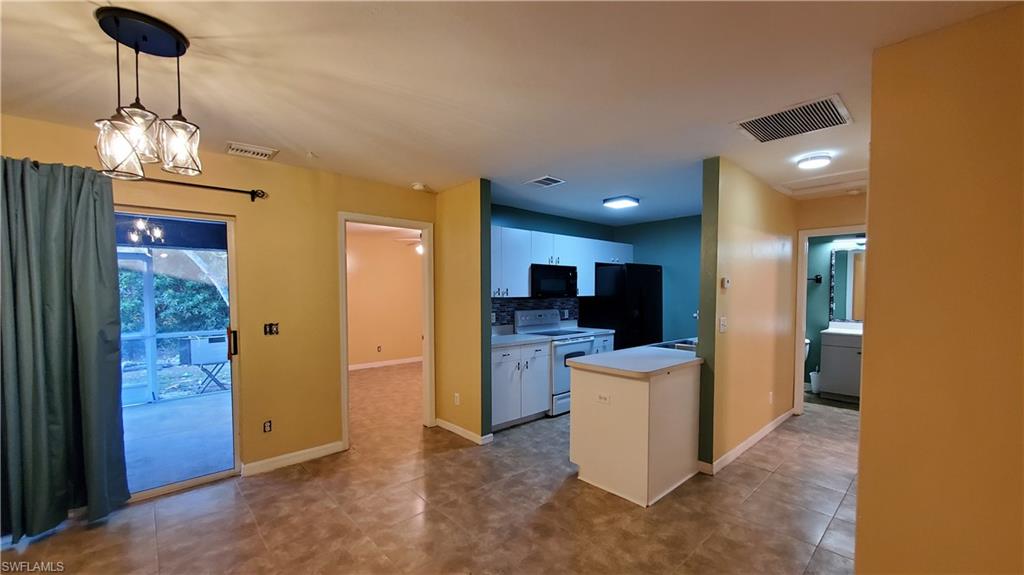 7319 Albany Road Fort Myers, FL 33967 - Photo 43 of 47 a view of a kitchen and a refrigerator