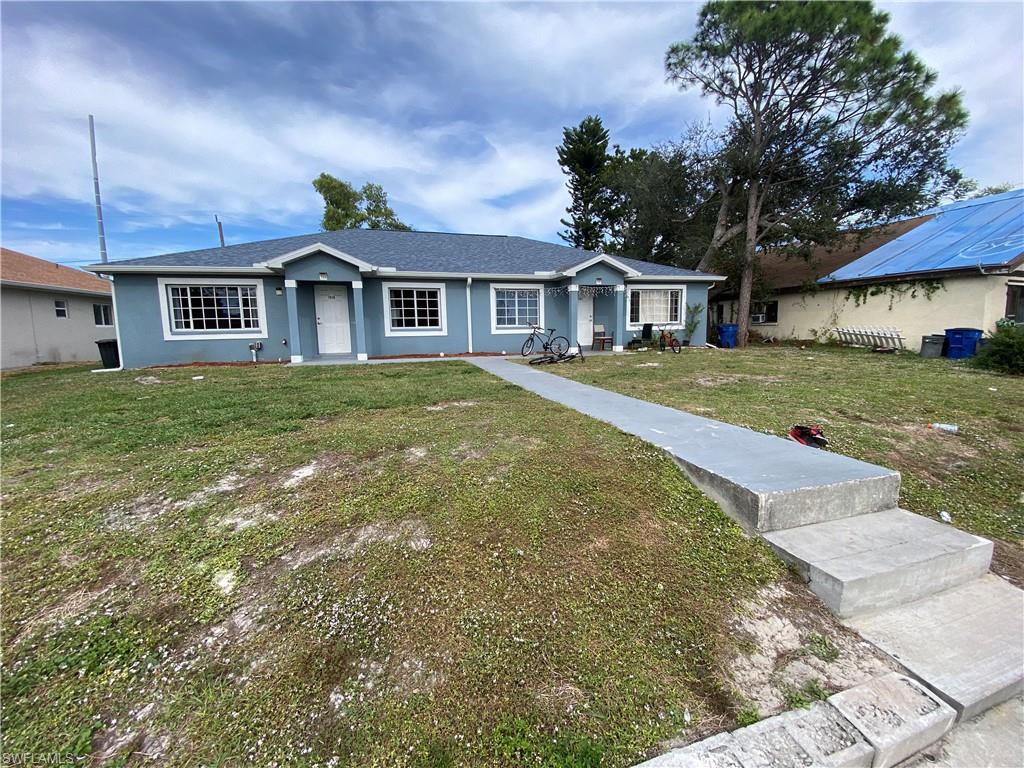 7319 Albany Road Fort Myers, FL 33967 - Photo 45 of 47 a front view of a house with a garden