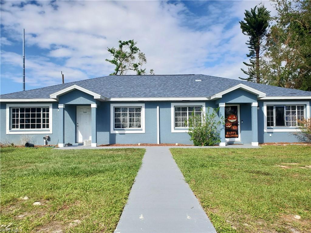7319 Albany Road Fort Myers, FL 33967 - Photo 8 of 47 a front view of a house with a garden