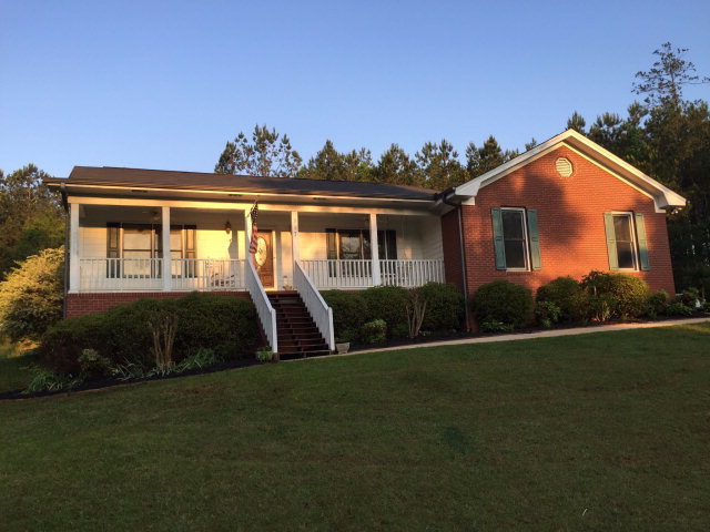 517 Hamlin Road, Unit TRACT Jackson, GA 30233 - Photo 1 of 44 a front view of a house with a garden
