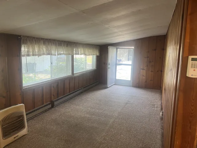 a view of an empty room with a window