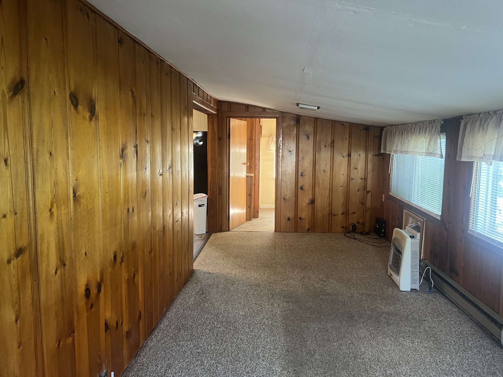 207 Powell Street Decherd, TN 37324 - Photo 13 of 18 a view of a livingroom with an empty space and a window