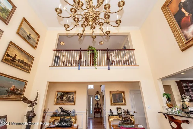a living room with fireplace furniture and a large window