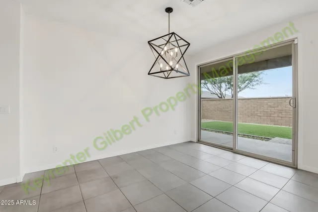 a kitchen with stainless steel appliances granite countertop a sink a stove a refrigerator and island