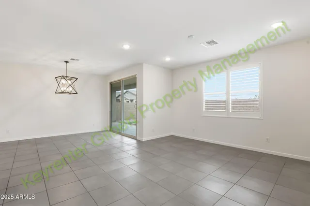 a kitchen with stainless steel appliances granite countertop a stove a microwave a sink and cabinets