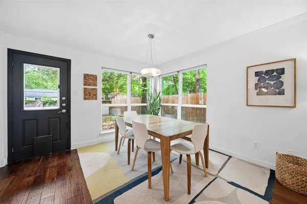 a kitchen with stainless steel appliances granite countertop a stove top oven a sink and a microwave