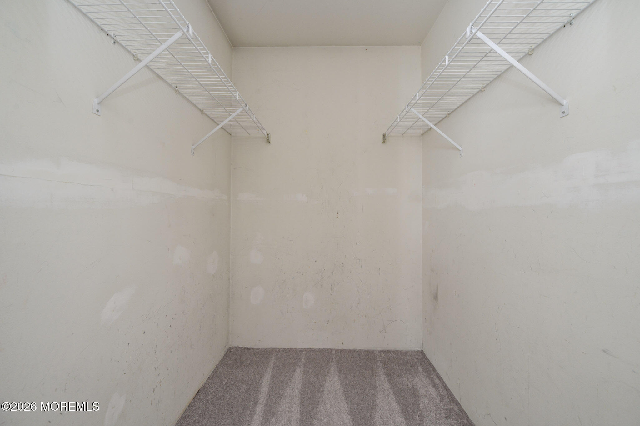 48 Frontier Way Tinton Falls, NJ 07753 - Photo 19 of 25 a view of a room with racks on the wall