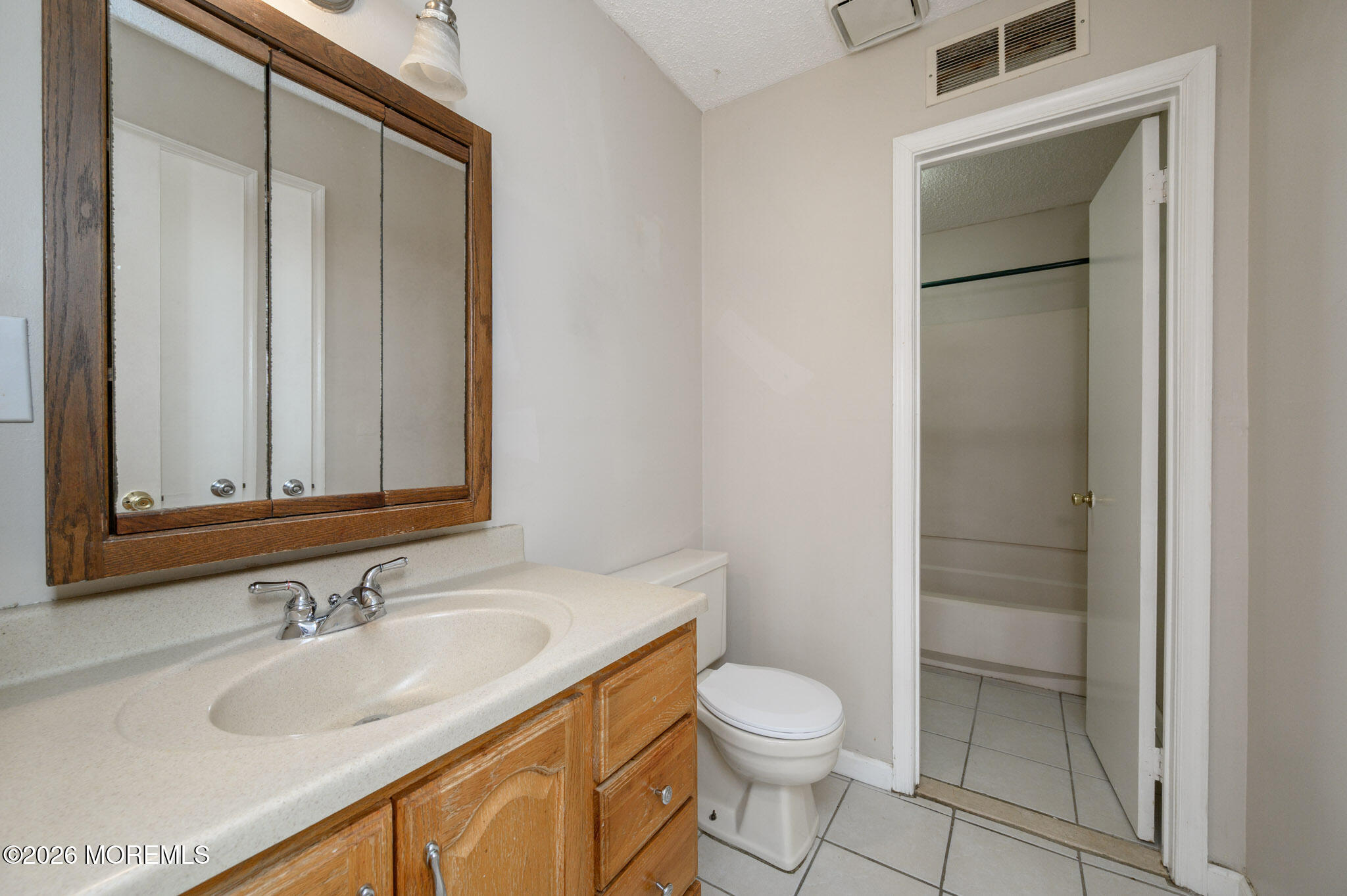 48 Frontier Way Tinton Falls, NJ 07753 - Photo 22 of 25 a bathroom with a granite countertop sink toilet and shower