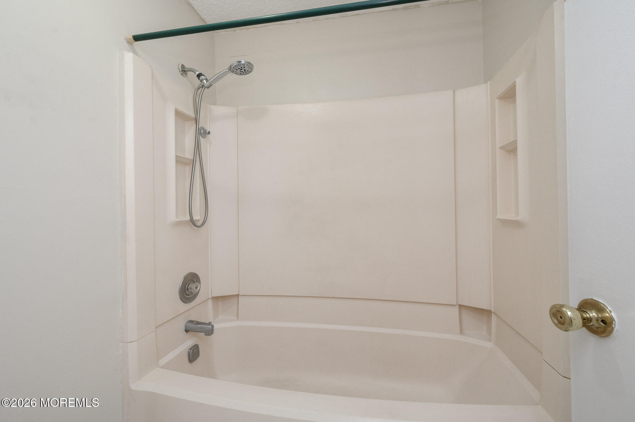 48 Frontier Way Tinton Falls, NJ 07753 - Photo 23 of 25 a white bath tub sitting next to a shower