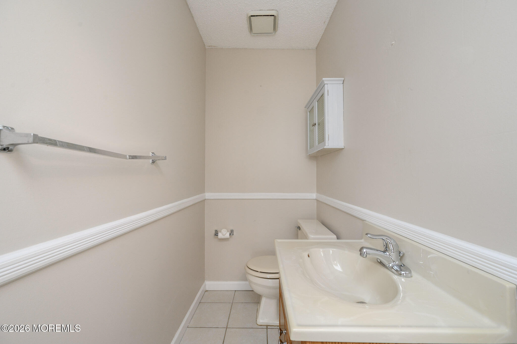 48 Frontier Way Tinton Falls, NJ 07753 - Photo 24 of 25 a bathroom with a sink toilet and vanity