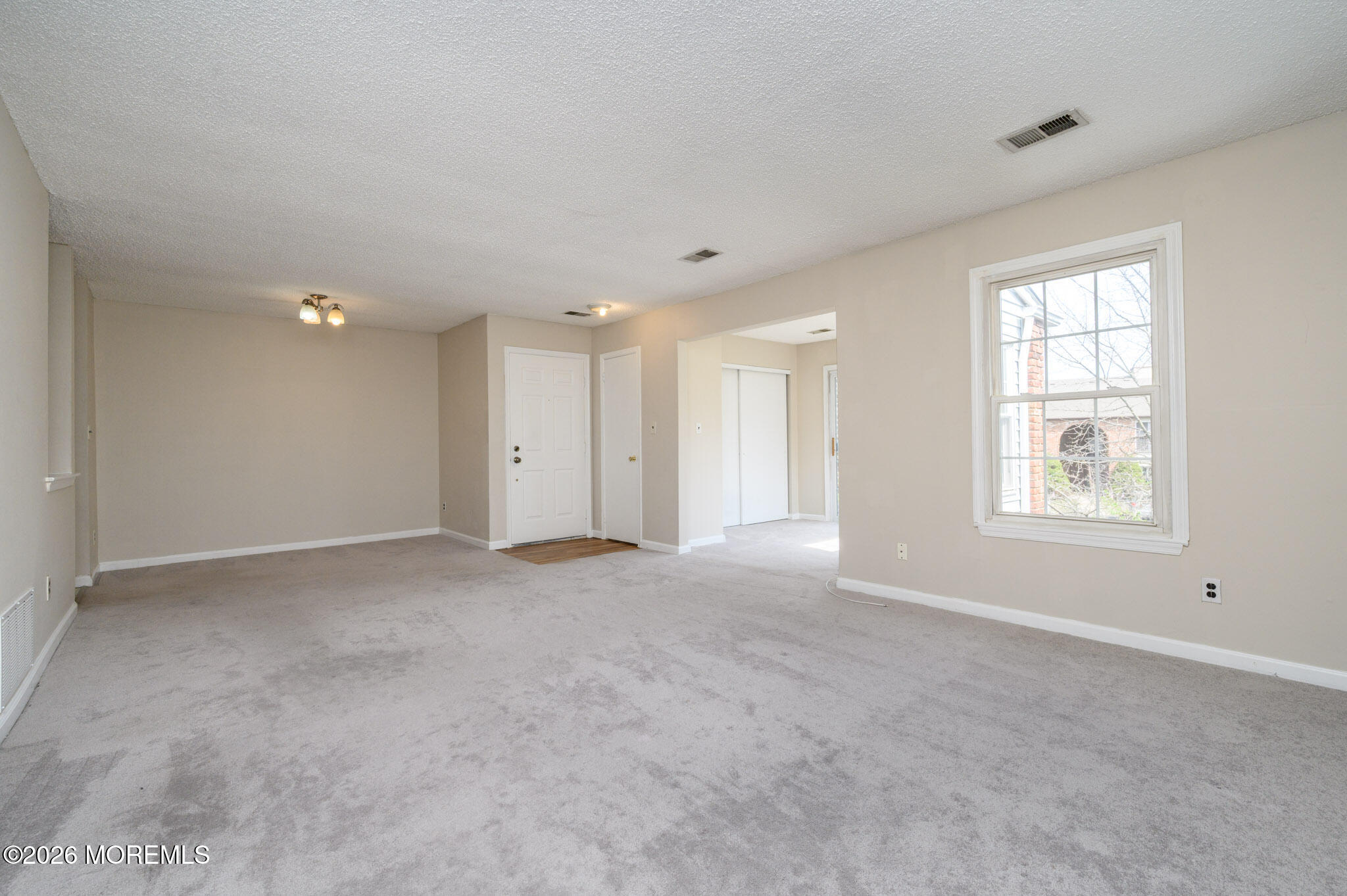 48 Frontier Way Tinton Falls, NJ 07753 - Photo 7 of 25 a view of an empty room with a window