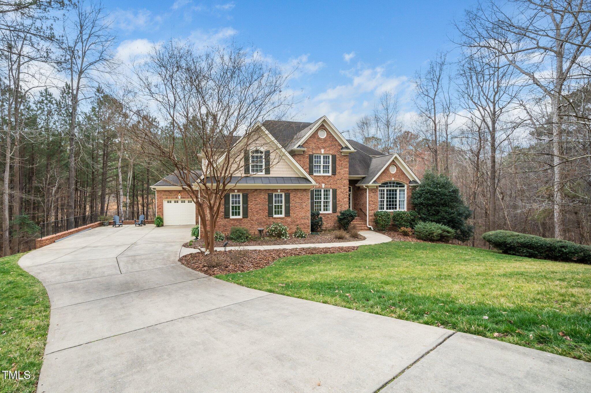 7001 Millstone Ridge Court Raleigh, NC 27614 - Photo 3 of 54 a front view of a house with yard and green space