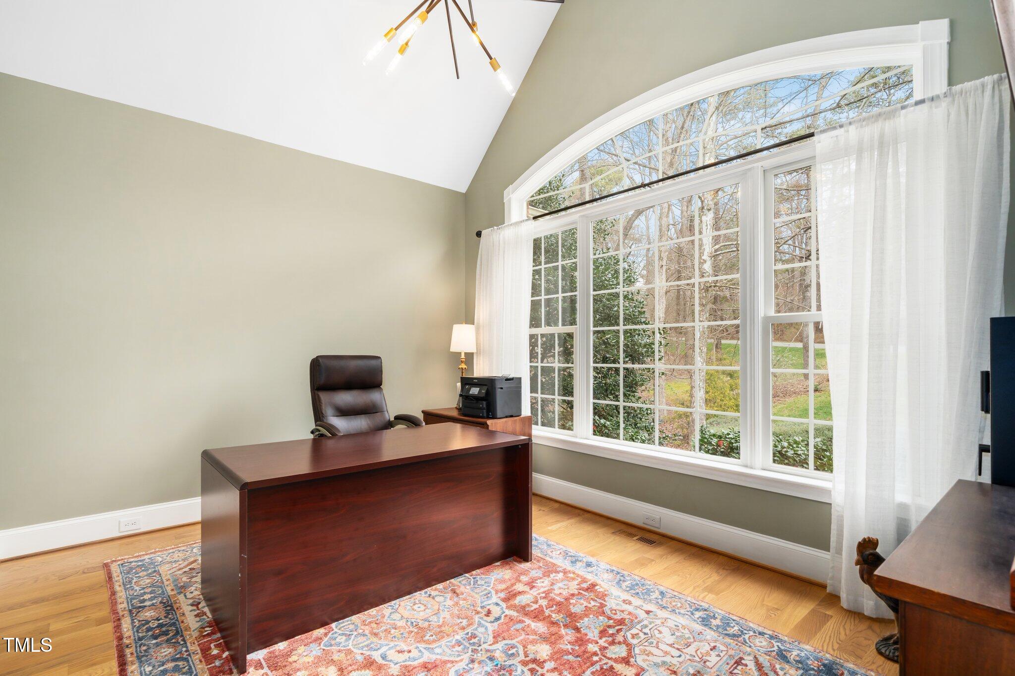7001 Millstone Ridge Court Raleigh, NC 27614 - Photo 6 of 54 a view of workspace with wooden floor windows
