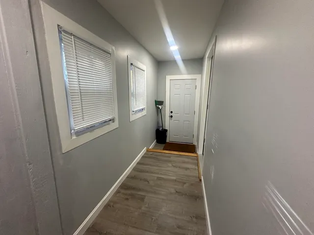 a view of hallway with windows