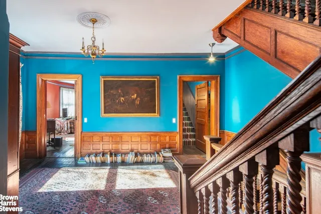 a dining room with stainless steel appliances furniture stove and kitchen view