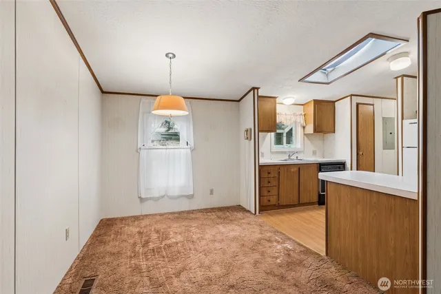 a bathroom with a sink vanity and mirror