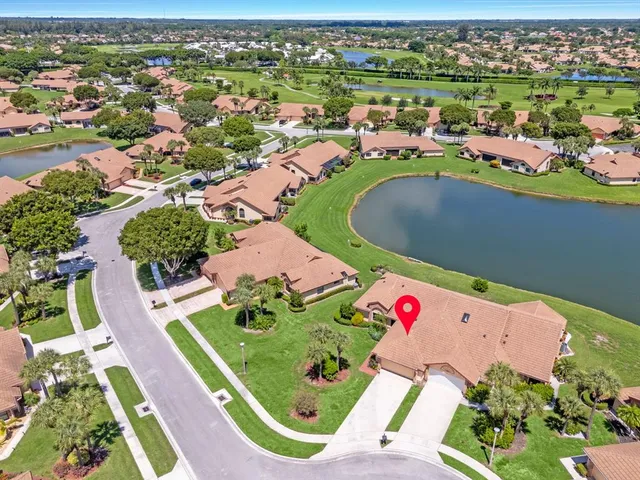 an aerial view of a house with a lake view